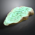 Green Carved Stone Decorative Object With Swirl Patterns For Home Use