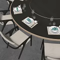 Elegant Tableware Set on Round Dining Table with Beige Chairs Green Napkins and Wine Glasses