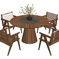 Stylish Wooden Round Dining Table Set With Four Chairs And Vase With Green Plants
