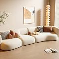 Beige Curved Three-Seater Sofa With Textured Cushions Abstract Painting And Spiral Floor Lamp
