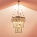 Elegant Multi Tiered Crystal Chandelier With Shiny Crystal Strands And Gold Accents Hanging In Room