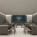 Hotel Public Lounge Area With Long Tables Chairs Gray Walls Ceiling Lights And Green Plants
