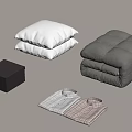 Cozy Bedding And Clothing Essentials With White Pillows Gray Quilt Dark Box And Folded Shirts