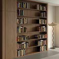 Modern Wooden Bookcase With Multiple Shelves Filled With Books And Floor Lamp