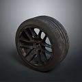 Black Car Tire With Stylish Alloy Wheel Rim And Tread Pattern