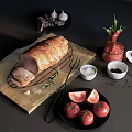 Fresh Roasted Meat Roll on Wooden Cutting Board with Rosemary Garlic and Fresh Tomatoes