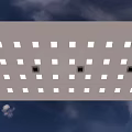 Modern Ceiling Grid Design with White Square Panels and Black Vents