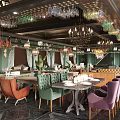 Elegant Restaurant Interior Design With Colorful Chairs Chandeliers And Hanging Wine Glasses