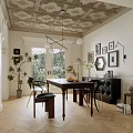 Elegant Restaurant Dining Space With Wooden Table Chairs Decorative Wall Art Patterned Ceiling And Herringbone Floor