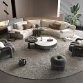 Modern Sectional Beige Sofa With Round Coffee Table And Gray Armchairs On Round Rug