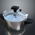 Modern Silver Pressure Cooker Kitchen Appliance With Black Handles And Knob