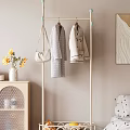 Standing Clothes Rack With White Coat Gray Sweater Beige Bag Blue Hooks In Cozy Bedroom