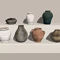 Ceramic Vessels In Various Colors And Shapes On White Minimalist Shelf