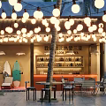 Outdoor Sanya Bar With Hanging String Lights Palm Trees Surfboards Bar Counter Tables Chairs