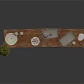 Wooden Display Table With Dessert Stand White Cups Silver Tray Stacked Plates And Green Plant