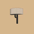 Elegant Wall Lamp with Beige Fabric Shade and Black Metal Bracket on Light Wall