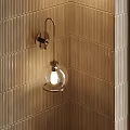 Stylish Wall Sconce with Glass Globe Shade and Illuminated Bulb on Textured Wall
