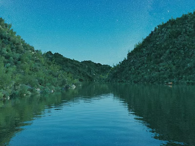 Lush Green Mountains Surrounding Calm Lake With Clear Blue Sky Reflections 3d model