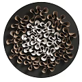 Circular Metal Wall Hanging With Brown Silver Curved Pieces And Spiral Pattern On Black Background