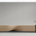 Outdoor Chair Featuring Concrete and Wooden Wavy Design with Small Planter Holding Green Plants