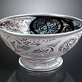 Intricate Sculpture Carving On Silver Bowl With Pedestal Base And Detailed Patterns