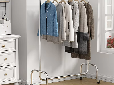 Sturdy Metal Clothes Rack On Wheels Hanging Various Clothes In Home Interior 3d model