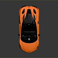 Orange Convertible Sports Car With Modern Design Black Top And Alloy Wheels