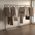 Stylish Clothes On Clothing Racks In Minimalist Room With Neutral Tones And Natural Light