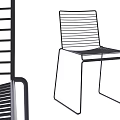 Modern Minimalist Leisure Chair Design With Slatted Back And Sleek Frame Structure
