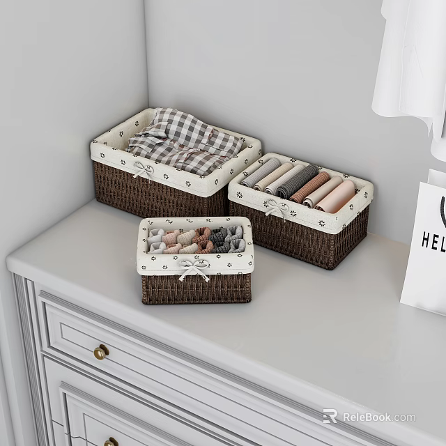 Brown Storage Baskets with White Trim on White Dresser Holding Folded Clothes 3d model 