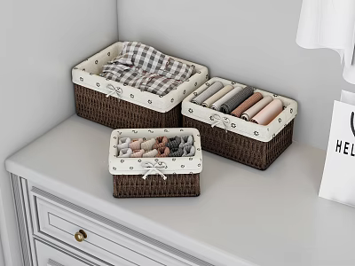 Brown Storage Baskets with White Trim on White Dresser Holding Folded Clothes 3d model