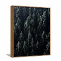 Plant Painting with Dark Green Forest Trees in Wooden Frame Hanging on Light Colored Wall