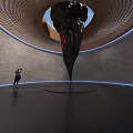 Spiral Art Installation With Black Pointed Structure Red Details And Blue Lighting