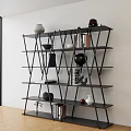 Modern Geometric Black Bookshelf With Multiple Shelves Holding Books And Decorative Vases