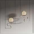 Modern Pendant Lights With Round Beige Shades Curved Metal Frames Two Hanging Over Gray Wall