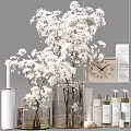 Elegant Perfume Cosmetics Display With White Flower Bouquet Clear Glass Vase And Skincare Bottles