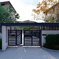 Elegant Entrance Gate With Black Metal Lattice Design Dark Canopy White Walls And Green Shrubs