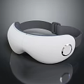 Sleek White Eye Massager With Black Strap And Circular Control Button