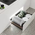 Modern Kitchen Interior Dinnerware Set Stored in Open Drawer with Plates and Bowls