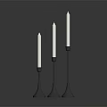 Modern Three Candle Holders With White Candles And Black Metal Conical Bases