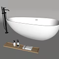 Modern Freestanding White Oval Bathtub With Black Faucet Wooden Tray Bath Products And Towels