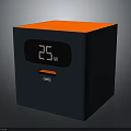 Cube Shaped Electronic Device With Orange Top Dark Blue Body 25w Display And Charging Port