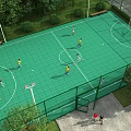Park Landscape Featuring Multi functional Sports Court Green Surface Football Goals Basketball Hoop Trees And Benches