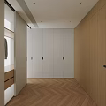Modern Walk in Closet Interior With White Cabinets Open Hanging Area And Herringbone Wood Floor