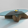 Modern Oval Glass Top Coffee Table With Curved Wooden Base And Tray Of Yellow Fruits