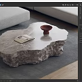 Irregular Shaped Marble Coffee Table With Open Book And Brown Bowl On Gray Rug