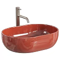 White Oval Vessel Sink with Black Faucet and Metallic Decorative Balls