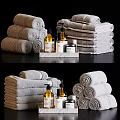 Bathroom Accessories With Rolled And Stacked Towels Liquid Soap Bottles On Marble Tray