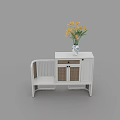 White Entryway Cabinet Sideboard With Wicker Doors And Vase Of Yellow Flowers