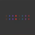 Colorful Geometric Blocks of Different Colors Arranged on Dark Background